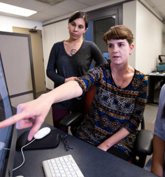 Students collaborating at a computer