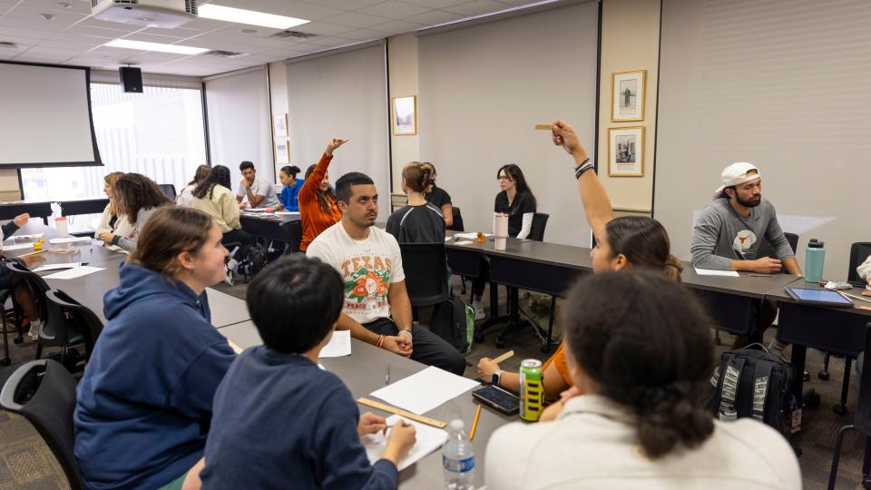 Students participating in a classroom activity in pairs