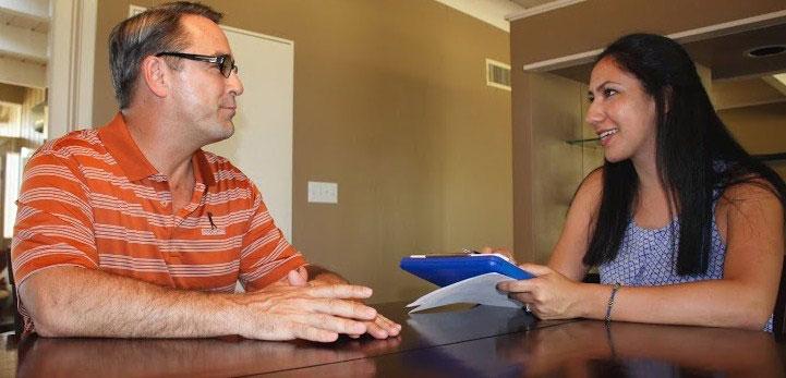 A researcher and a participant having a discussion