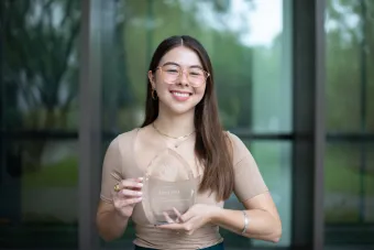 Image of Alyssa Field with her Impact Staff award