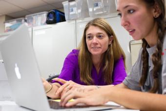 Students collaborating at a computer