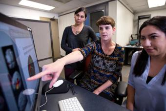 Students collaborating at a computer