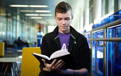 SLHS student reading a book